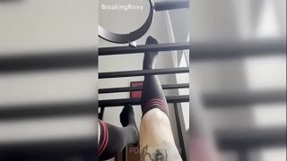 Caged Slave Girl in Knee High Socks Rubs Feet Against Bars